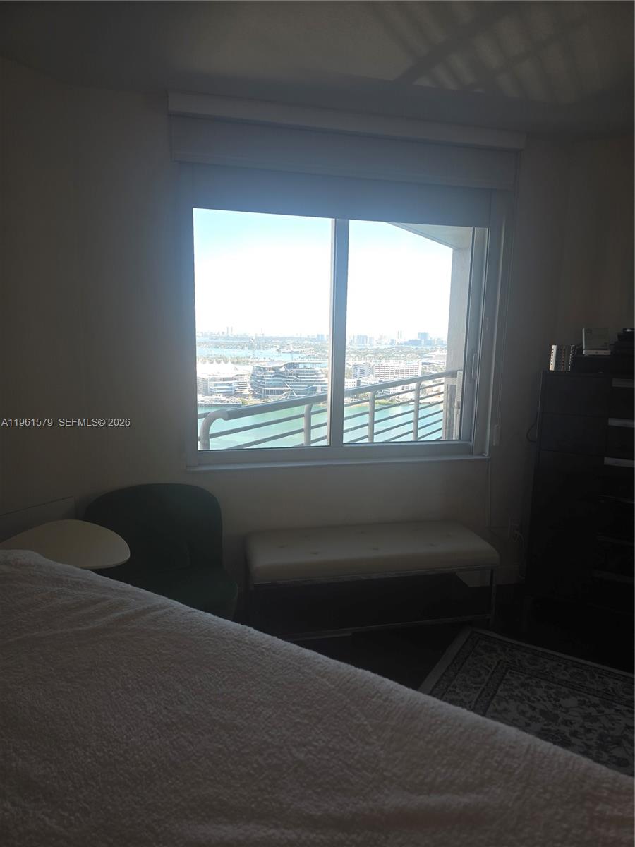 335 South Biscayne Boulevard, Unit 3400 Miami, FL 33131 - Photo 28 of 52 a living room with furniture and a window