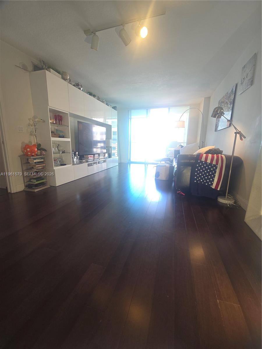 335 South Biscayne Boulevard, Unit 3400 Miami, FL 33131 - Photo 7 of 52 a living room with furniture and a fireplace