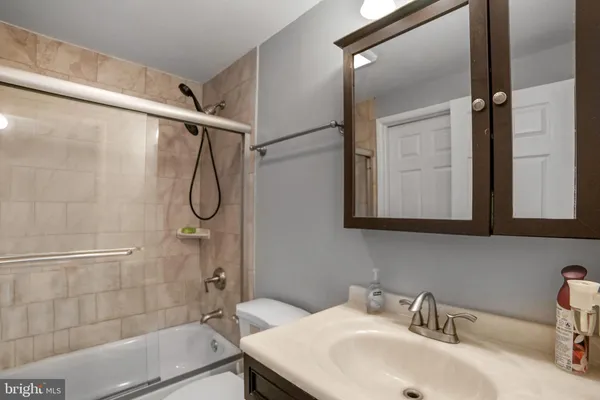a bathroom with a sink and a shower