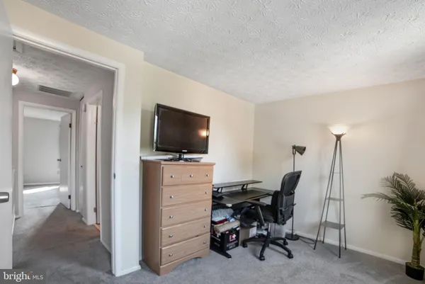 a view of a livingroom with a flat screen tv