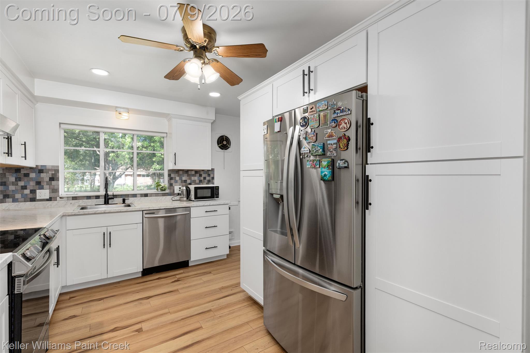 2731 Crooks Road Royal Oak, MI 48073 - Photo 12 of 34 Kitchen featuring light-tone wood-finish flooring