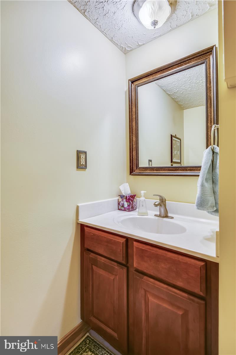 7718 Harmans Road Hanover, MD 21076 - Photo 16 of 58 Main Level Half Bath