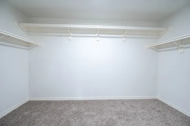 a view of an empty walk in closet