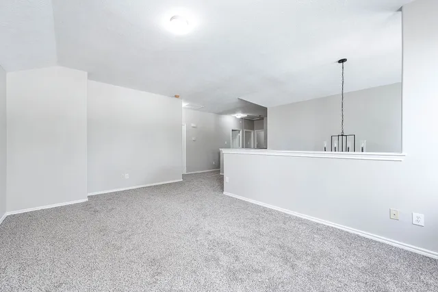 a view of a kitchen with a sink and cabinets
