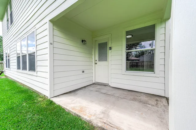 a view of a backyard of the house