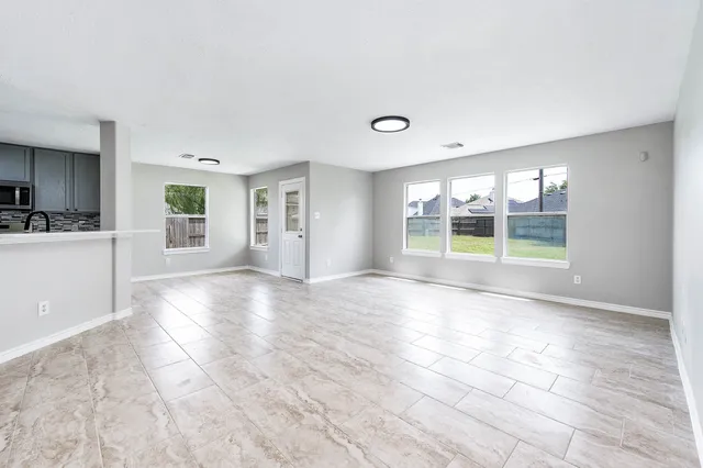 a view of an empty room with a window