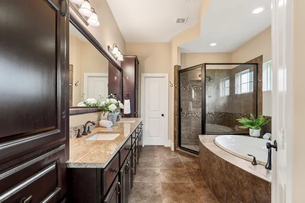 a bathroom with a granite countertop sink mirror and double
