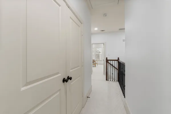 a view of a chairs and table on the balcony