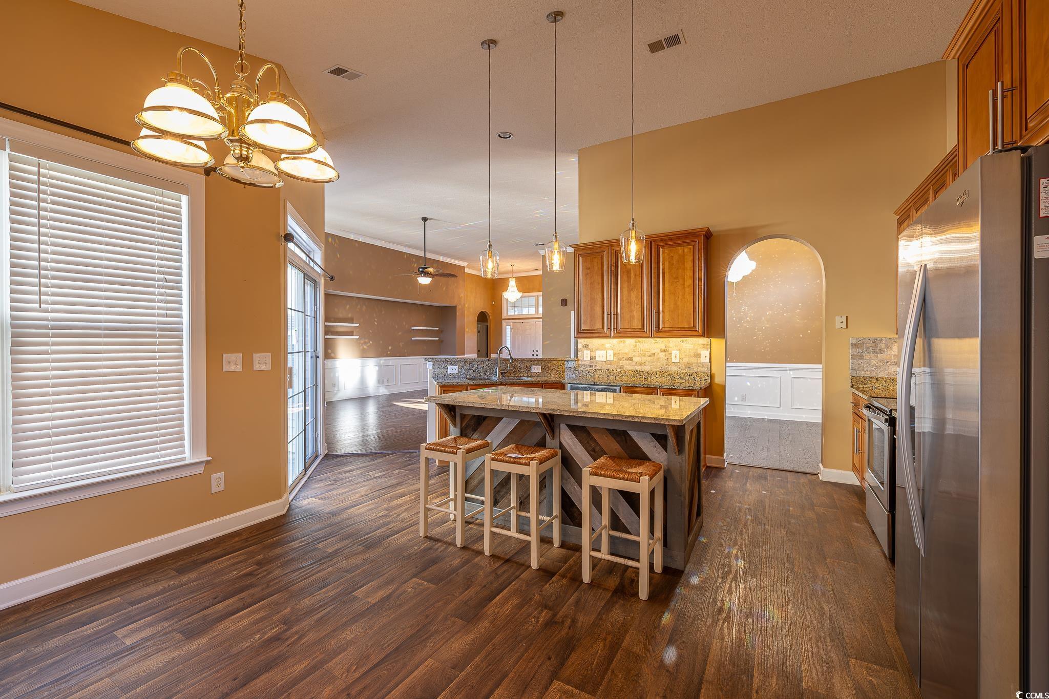 9833 Winchester Court Murrells Inlet, SC 29576 - Photo 25 of 29 Kitchen featuring kitchen peninsula, hanging light