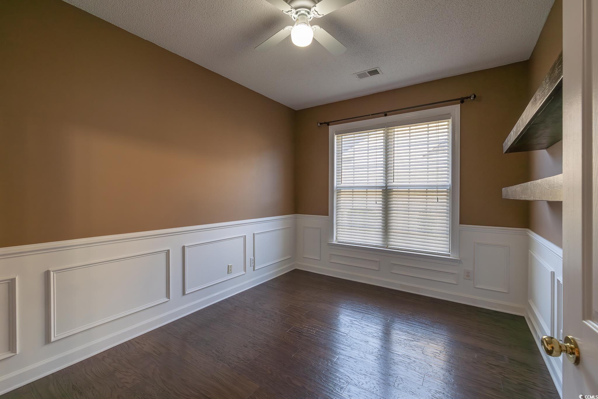 9833 Winchester Court Murrells Inlet, SC 29576 - Photo 29 of 29 Spare room with a textured ceiling, ceiling fan, a