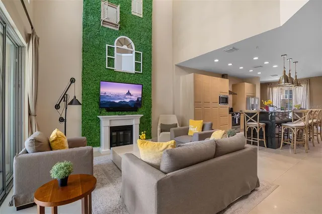 a living room with furniture fireplace and window