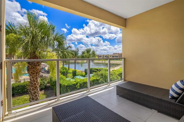 a view of a room with wooden floor and a large window