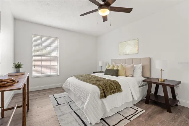 a bed room with a bed and a window