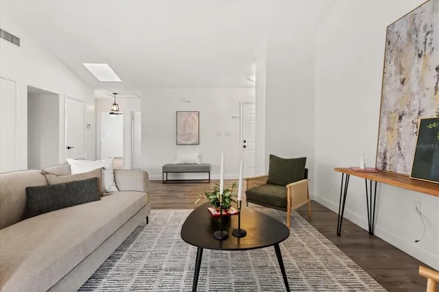 a living room with furniture and a rug