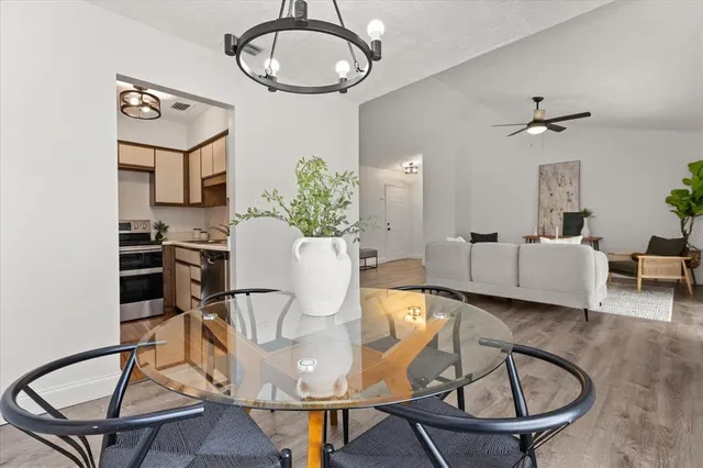 a view of a livingroom with furniture and a table