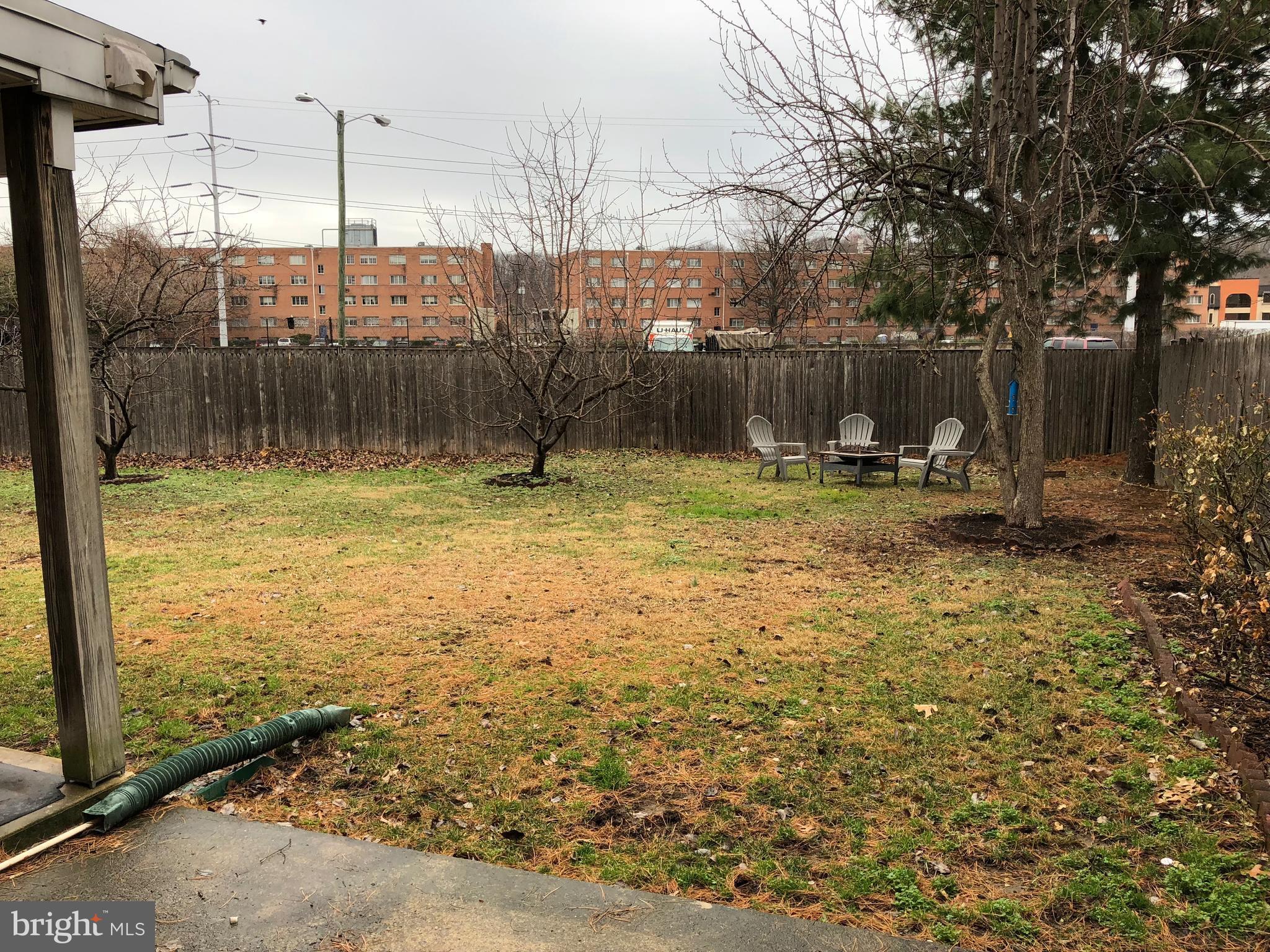 725 Four Mile Road Alexandria, VA 22305 - Photo 20 of 23 a backyard of a house with table and chairs