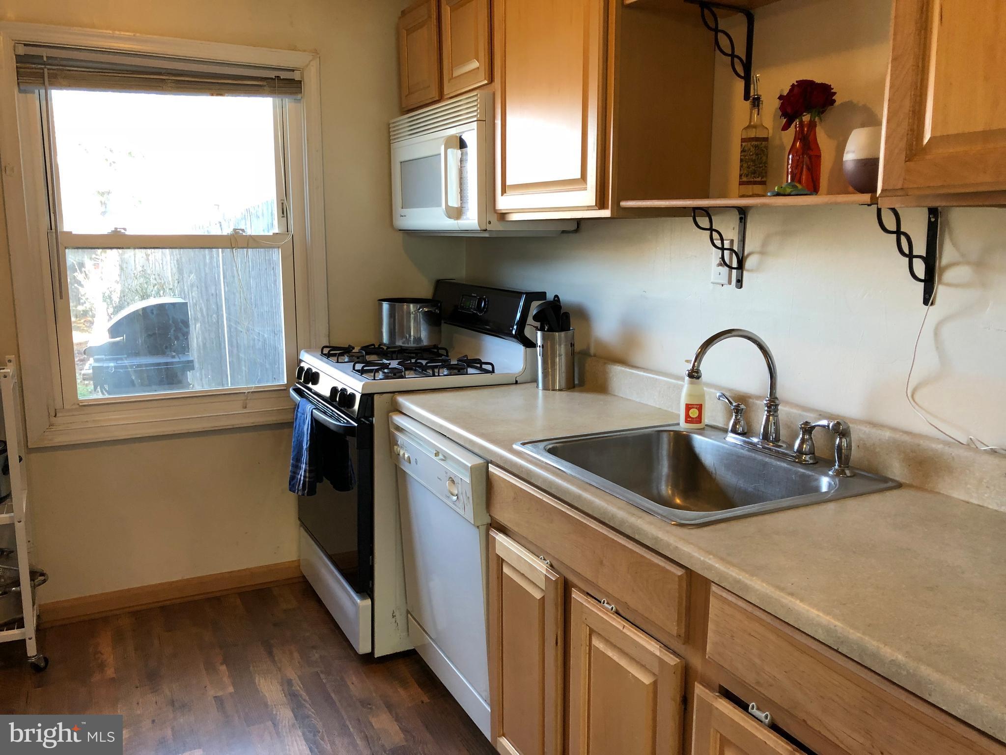 725 Four Mile Road Alexandria, VA 22305 - Photo 7 of 23 a kitchen with a sink and a window