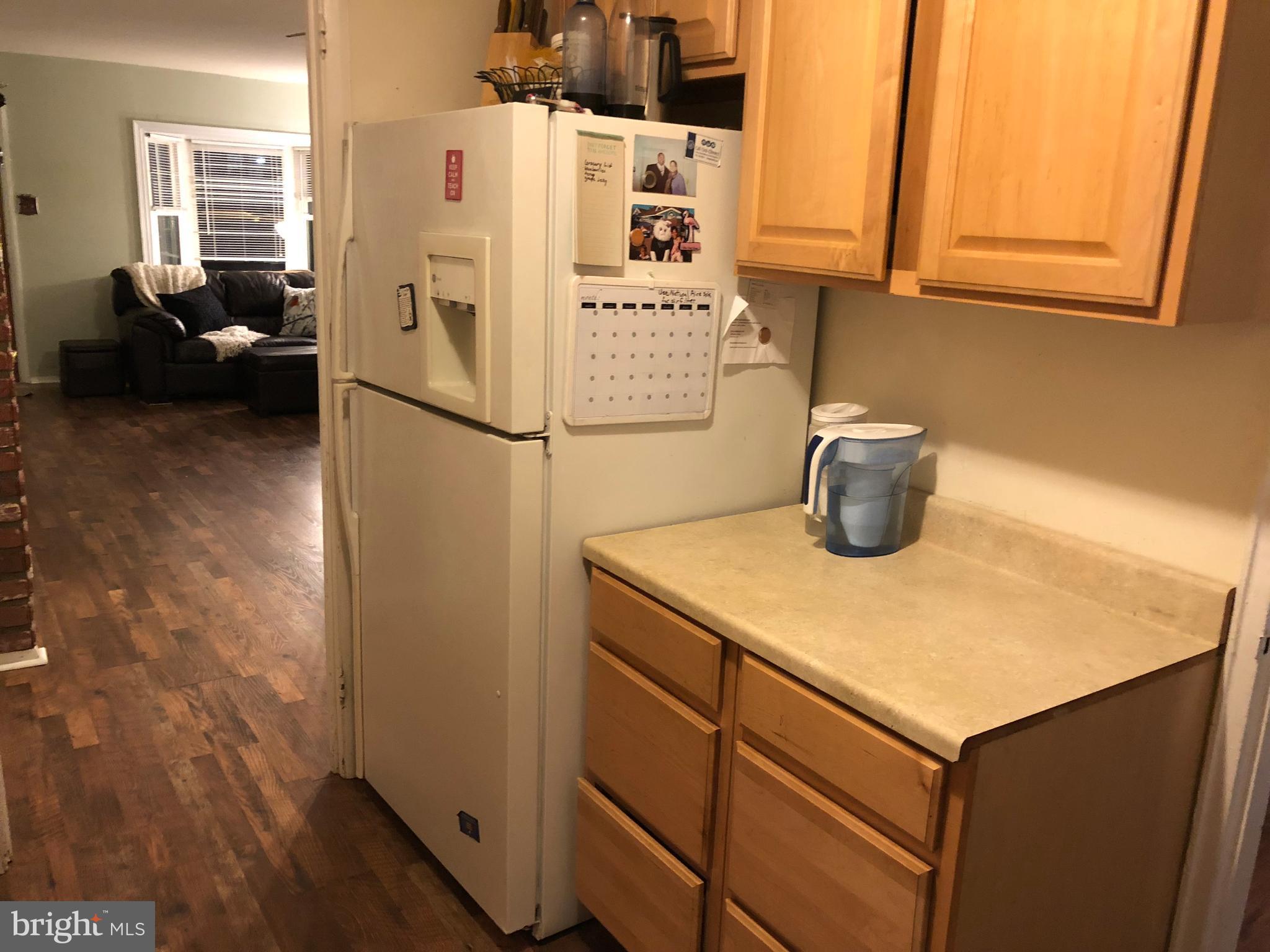 725 Four Mile Road Alexandria, VA 22305 - Photo 9 of 23 a white refrigerator freezer sitting in a kitchen