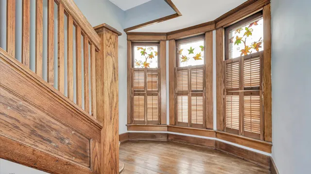 a view of entryway with wooden floor and door