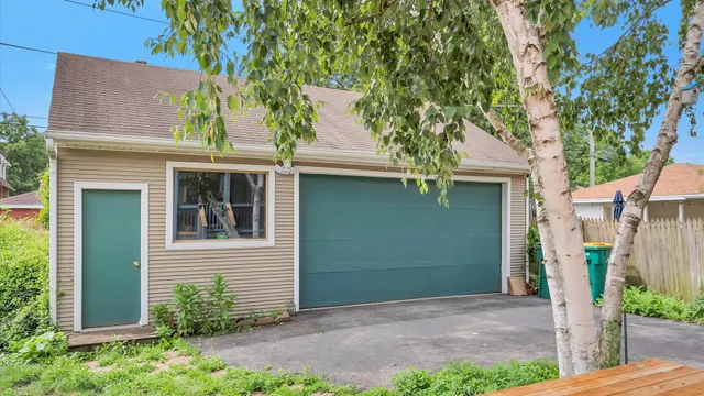 front view of a house with a tree