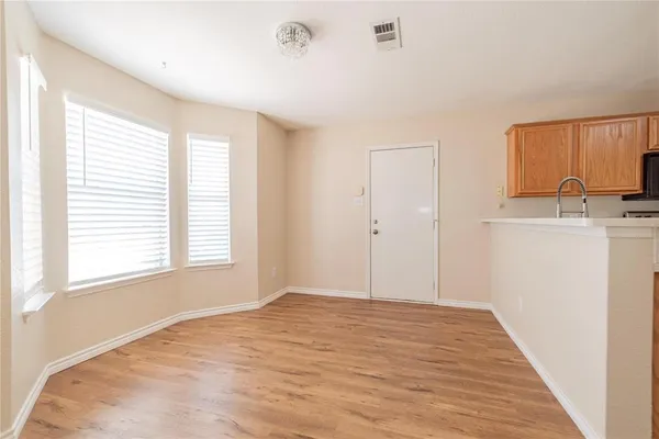 a view of a kitchen with a sink and a window