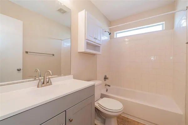a bathroom with a sink a toilet and a bathtub