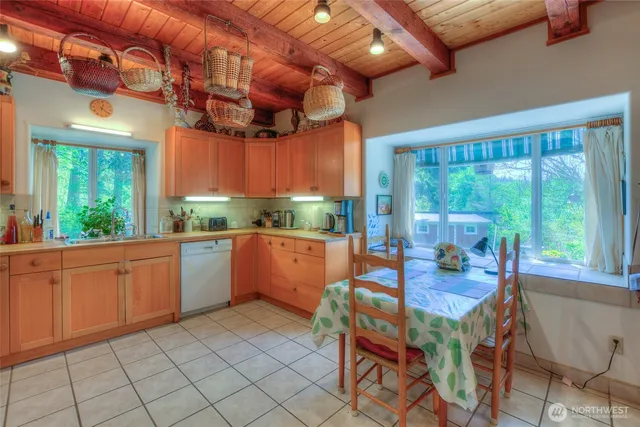 a dining room with a table and chairs