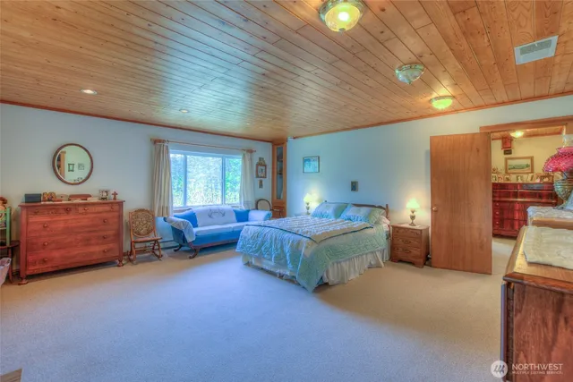 a bed room with bed and window