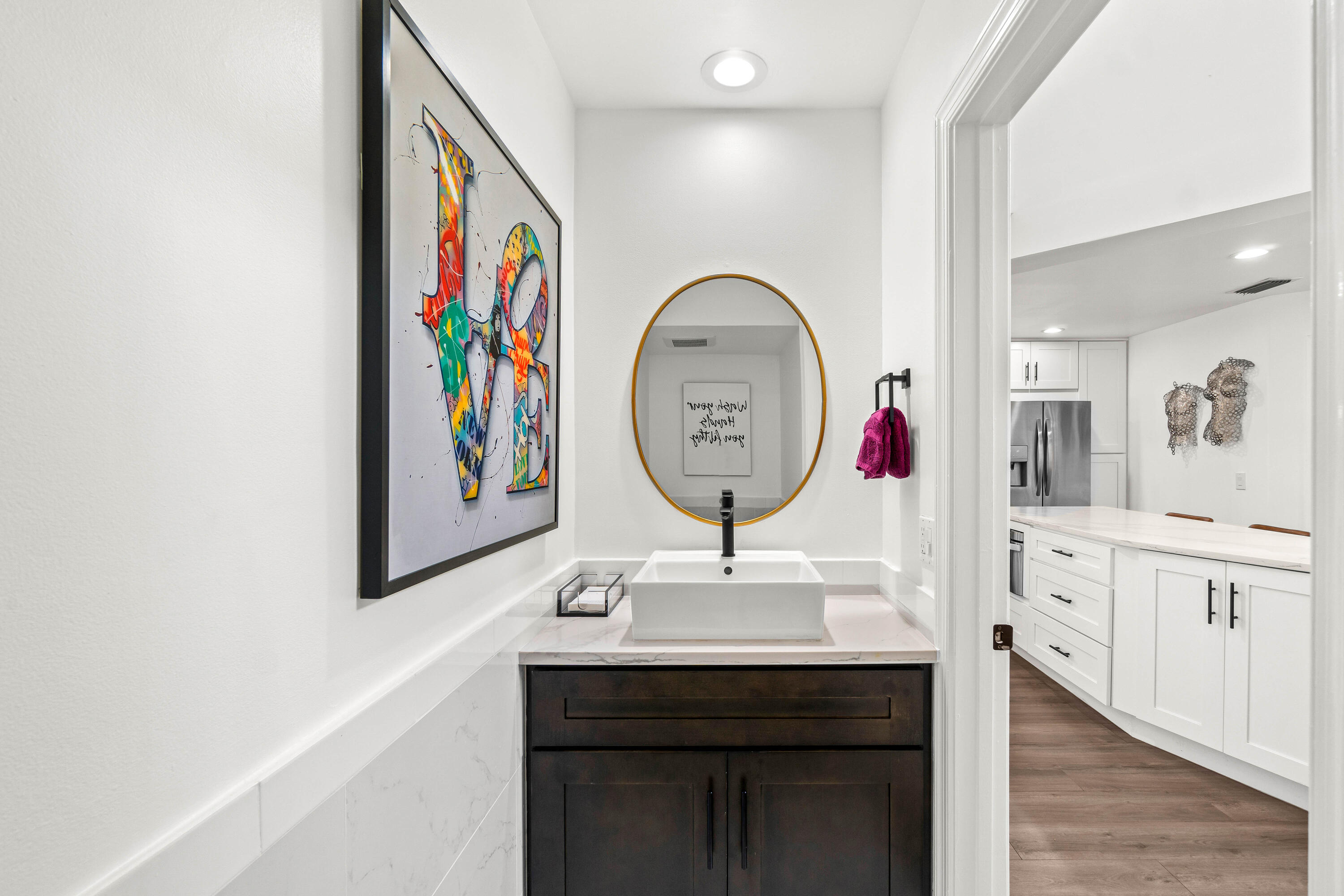 9226 Boca Gardens Parkway, Unit E Boca Raton, FL 33496 - Photo 16 of 40 a room with painting on the wall and a mirror
