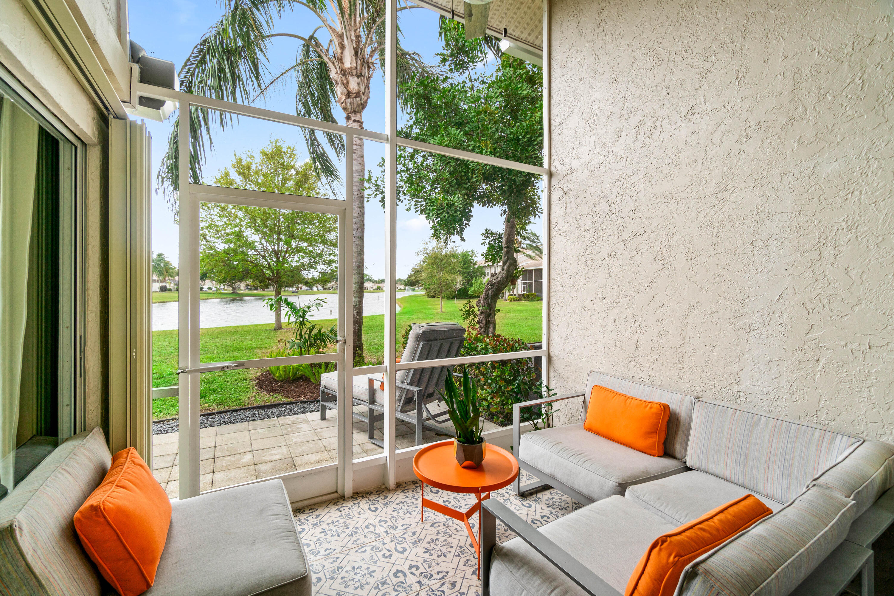 9226 Boca Gardens Parkway, Unit E Boca Raton, FL 33496 - Photo 31 of 40 a outdoor living space with patio furniture and garden view
