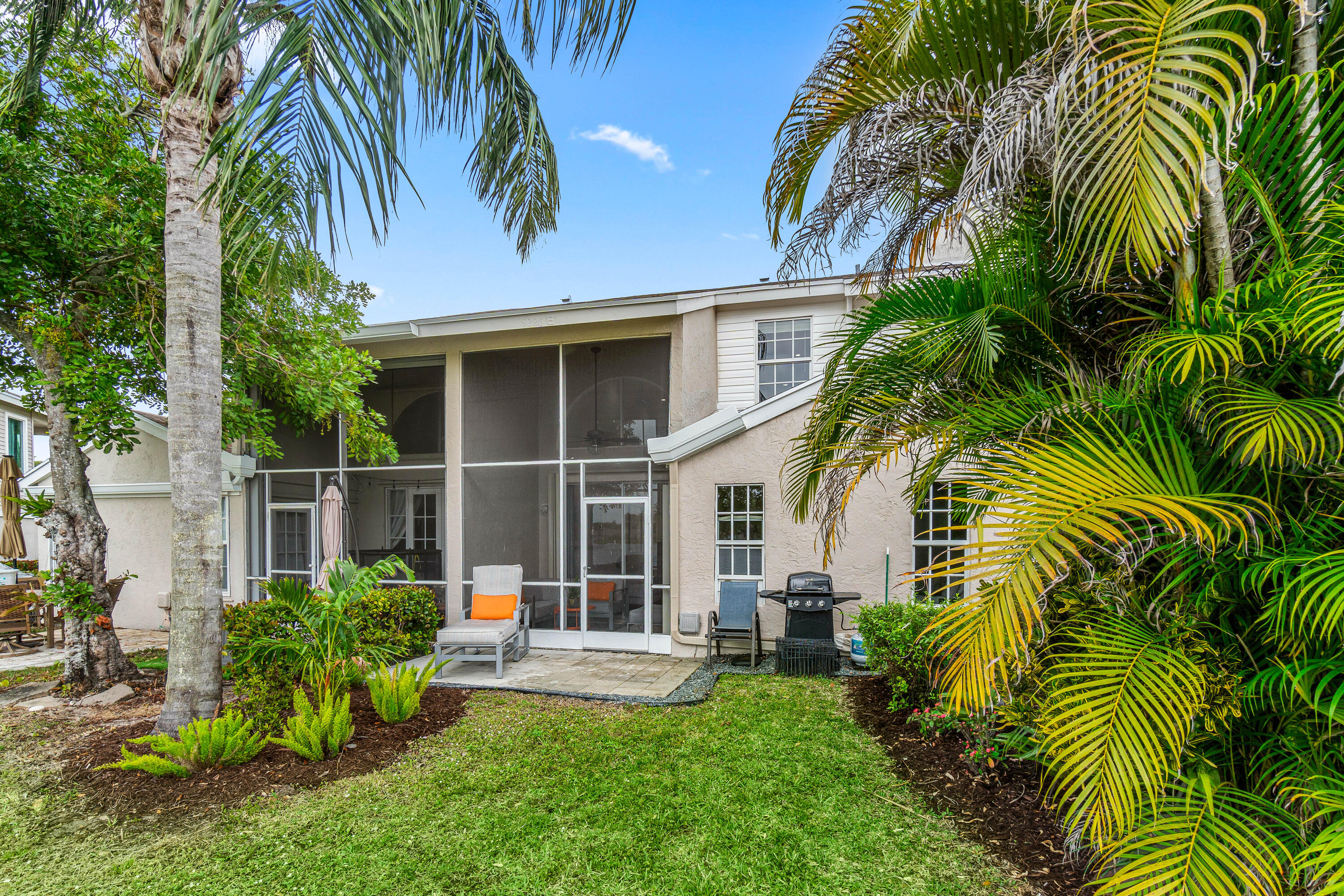 9226 Boca Gardens Parkway, Unit E Boca Raton, FL 33496 - Photo 35 of 40 a view of a house with a patio