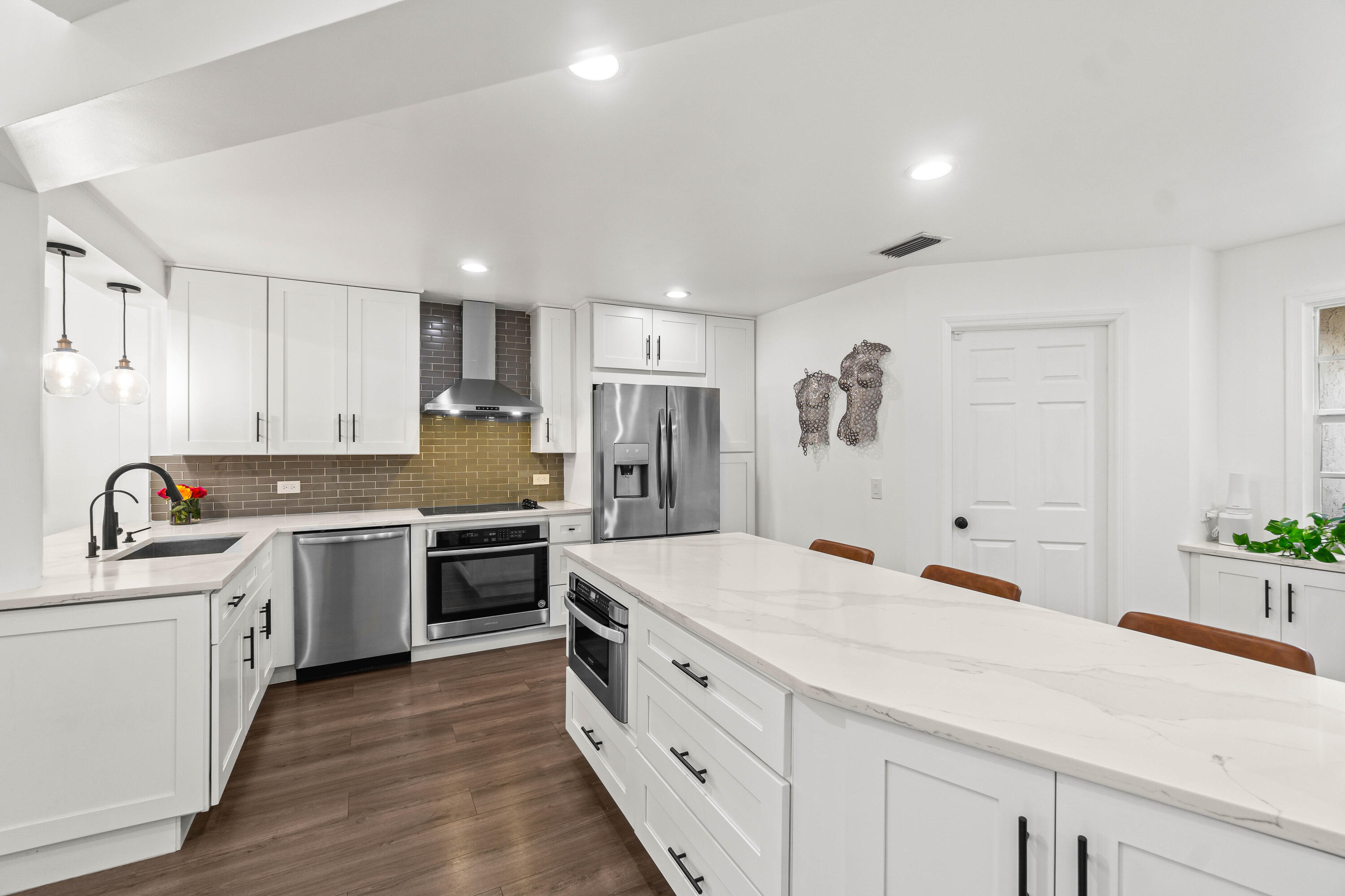 9226 Boca Gardens Parkway, Unit E Boca Raton, FL 33496 - Photo 5 of 40 a kitchen with stainless steel appliances granite countertop a sink and cabinets