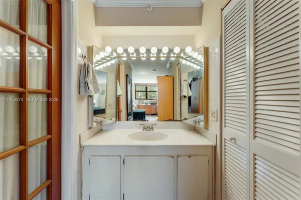 a bathroom with a sink and a mirror