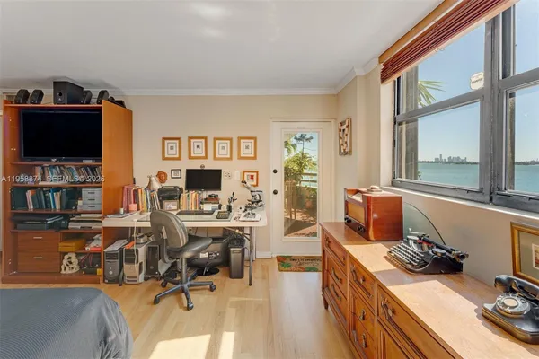 a living room with furniture window and flat screen tv