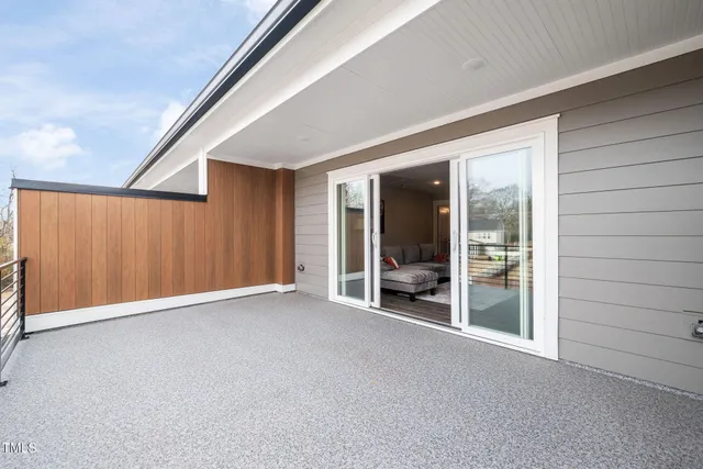 a view of an empty room with glass door