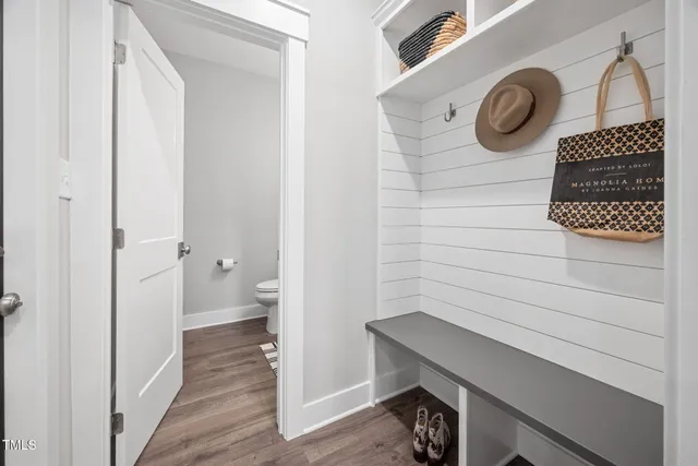 a bathroom with a sink toilet and a mirror