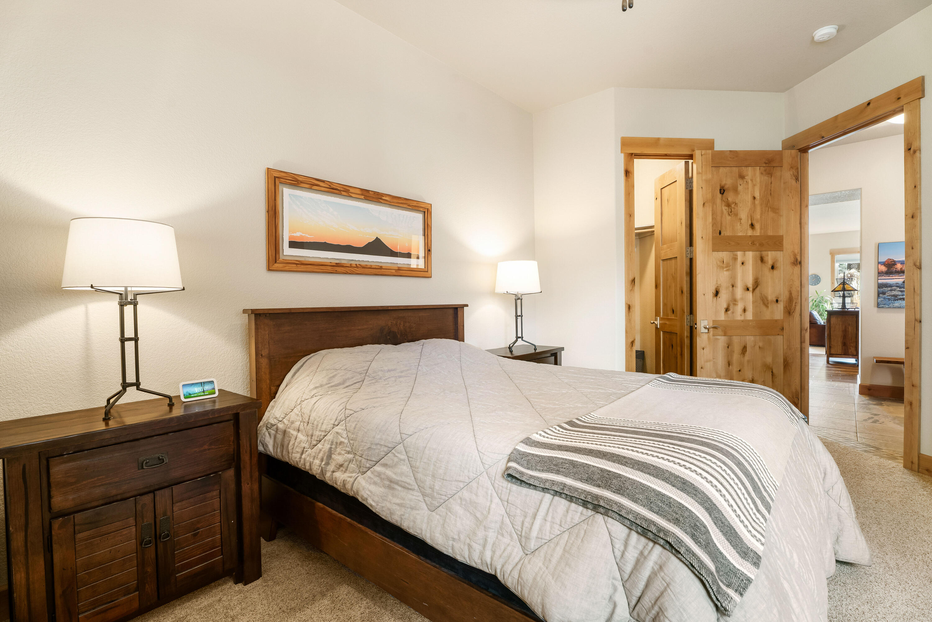 18667 Coffee Court Bend, OR 97702 - Photo 10 of 30 a bedroom with a bed and a lamp