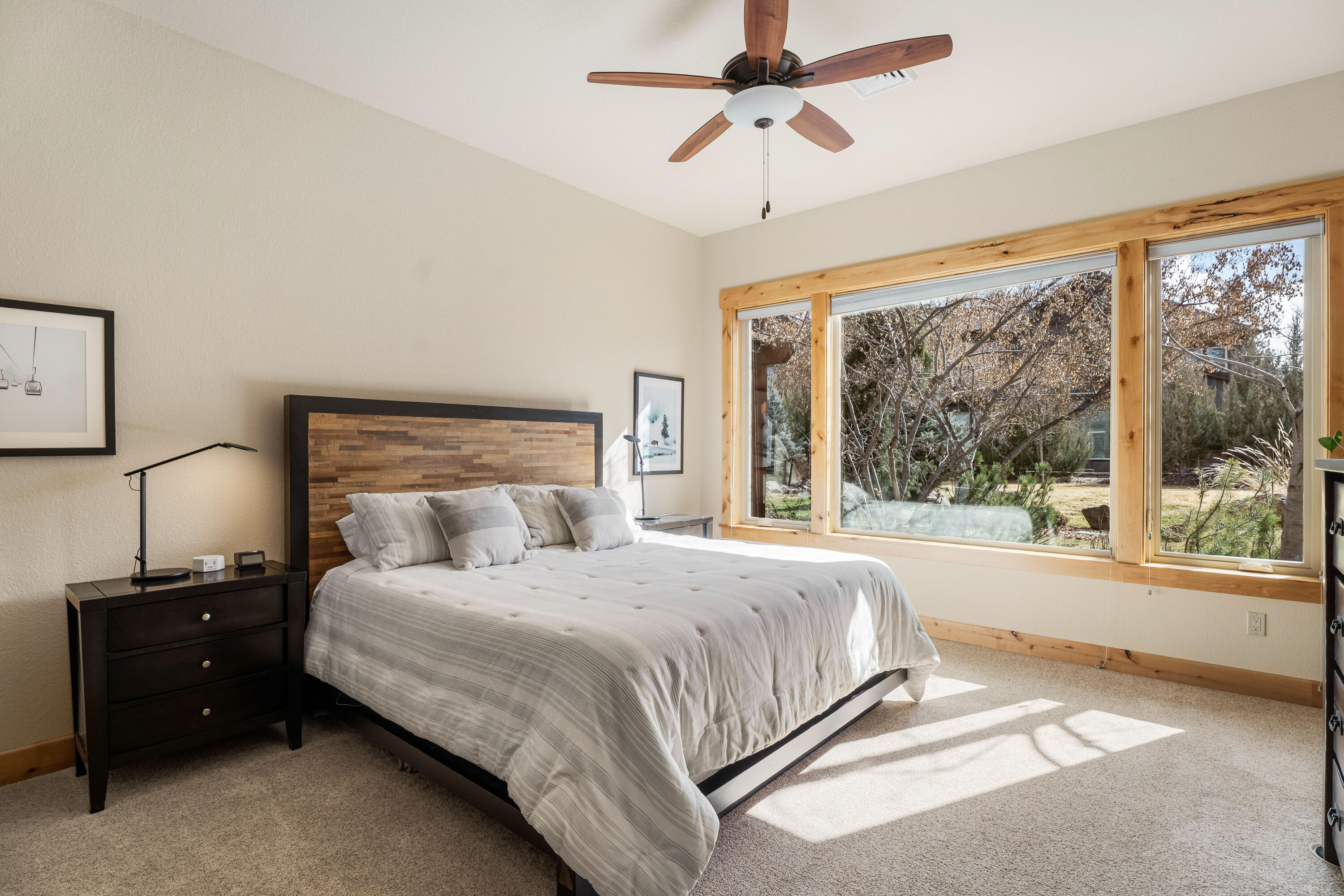 18667 Coffee Court Bend, OR 97702 - Photo 24 of 30 a bedroom with a large bed and a large window