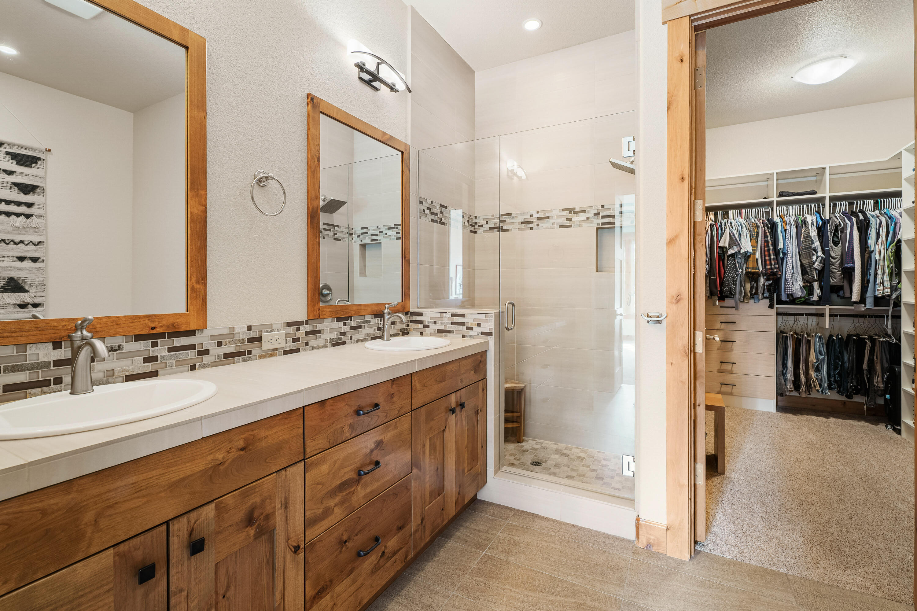 18667 Coffee Court Bend, OR 97702 - Photo 26 of 30 a bathroom with a double vanity sink and a mirror