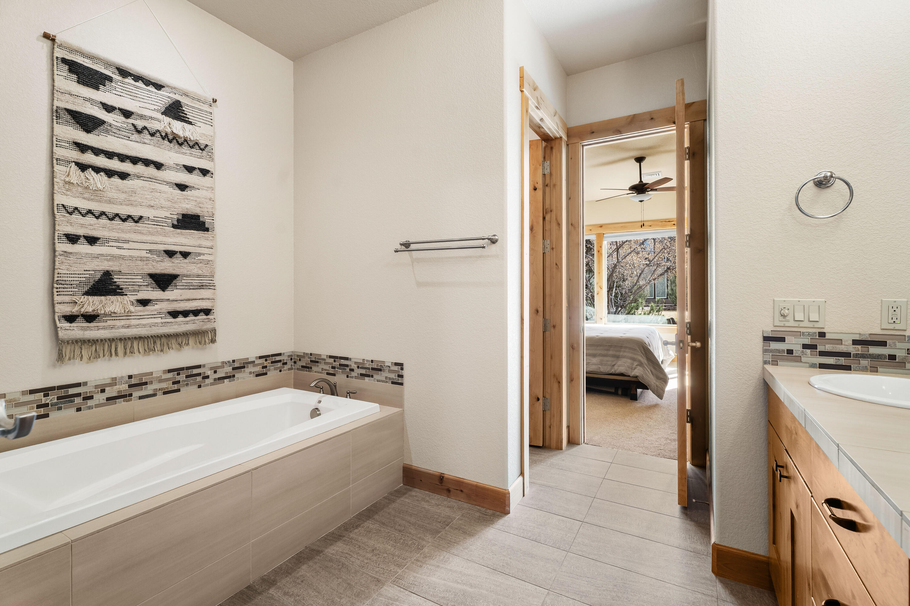 18667 Coffee Court Bend, OR 97702 - Photo 27 of 30 a bathroom with a bathtub and a sink
