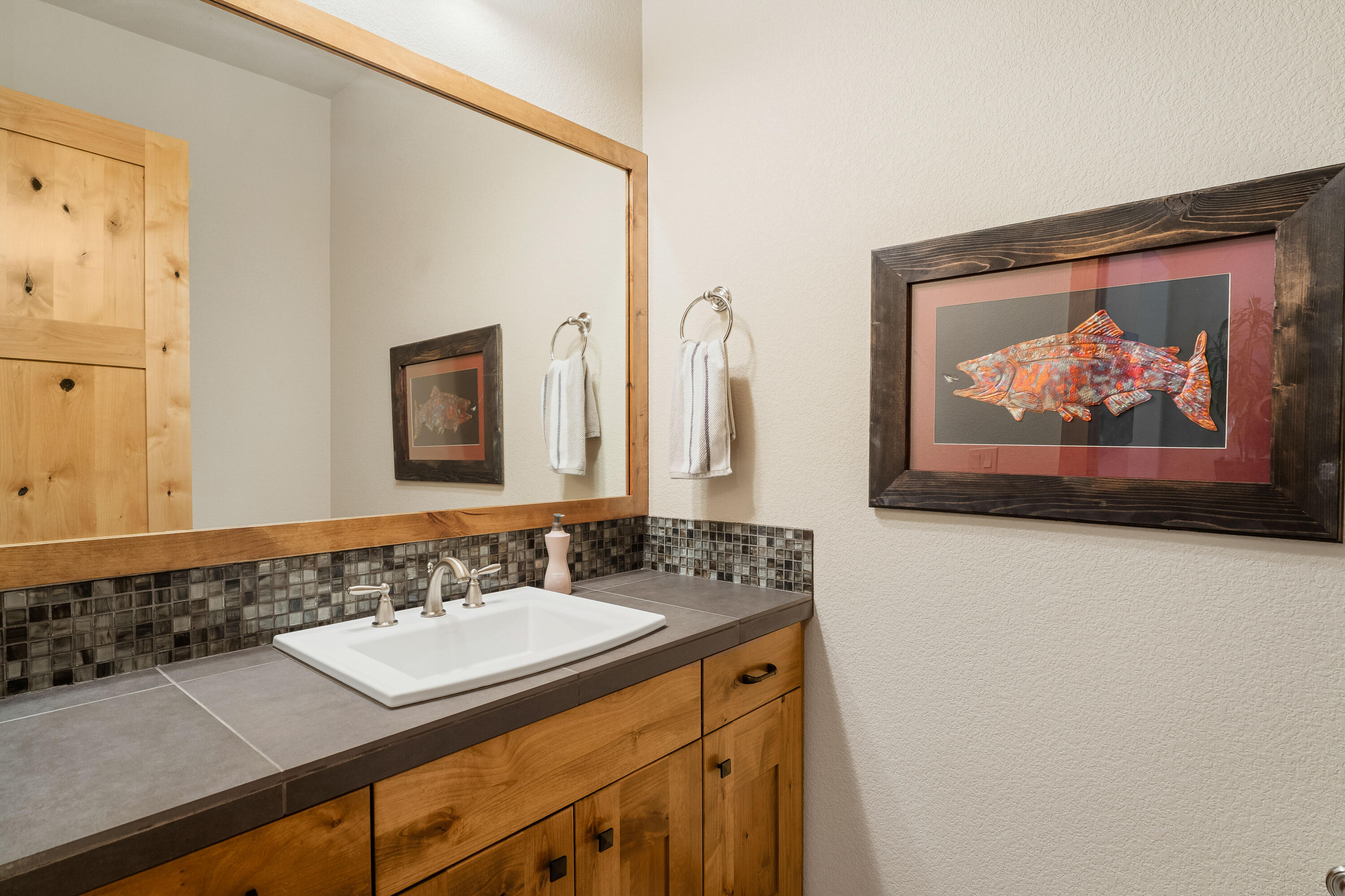 18667 Coffee Court Bend, OR 97702 - Photo 8 of 30 a bathroom with a sink and a mirror