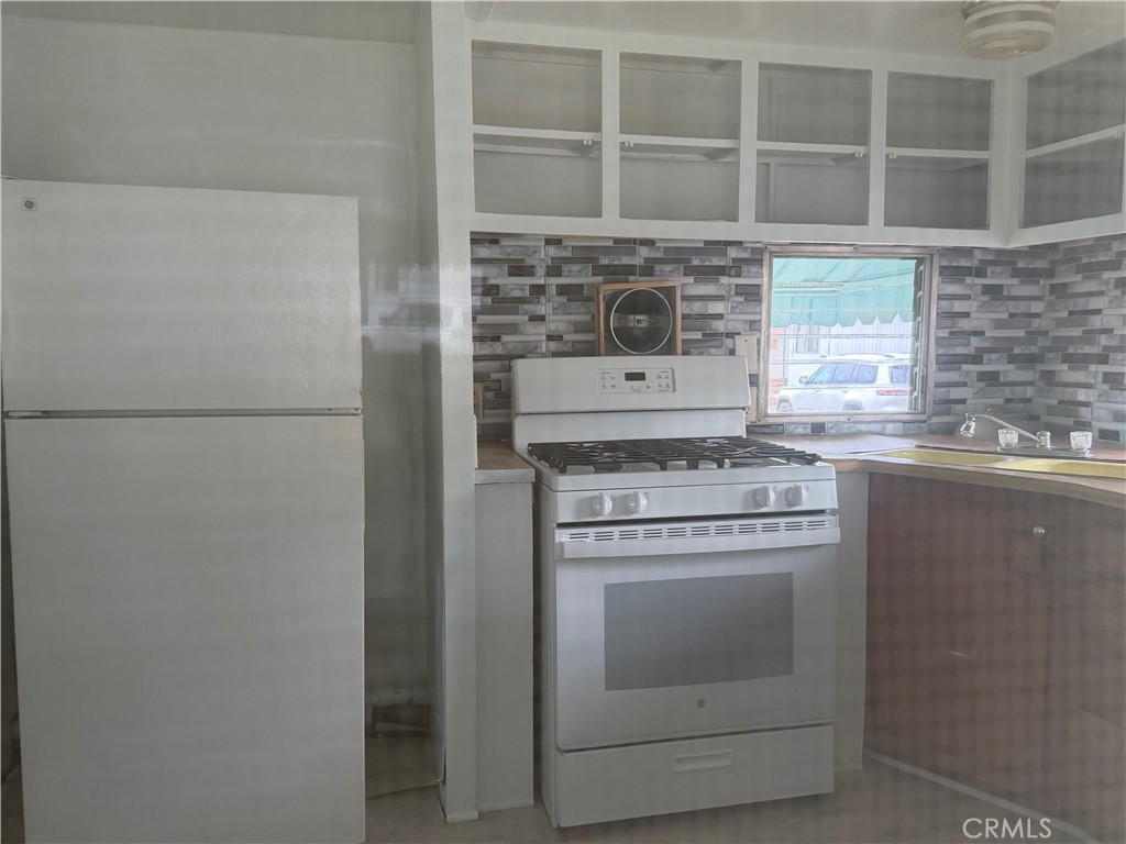 5877 Lake Street, Unit 23 Lucerne, CA 95458 - Photo 15 of 19 a stove top oven sitting inside of a kitchen