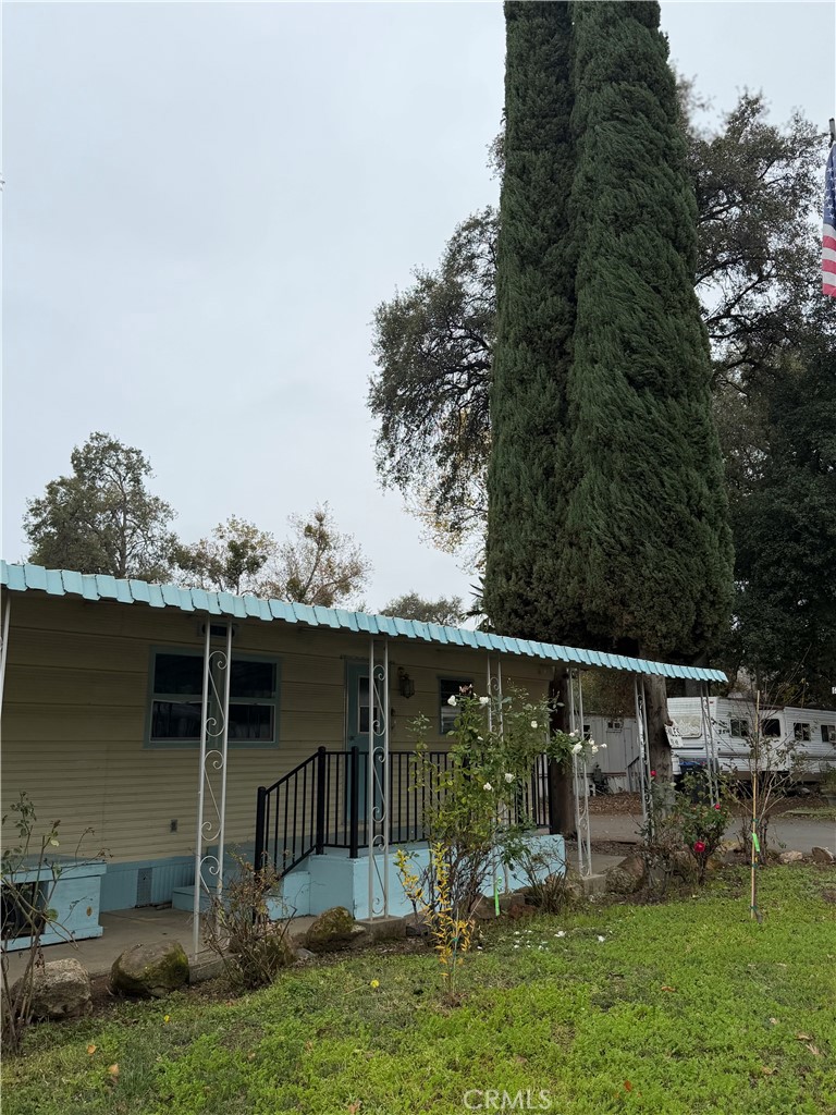 5877 Lake Street, Unit 23 Lucerne, CA 95458 - Photo 19 of 19 a backyard of a house with table and chairs