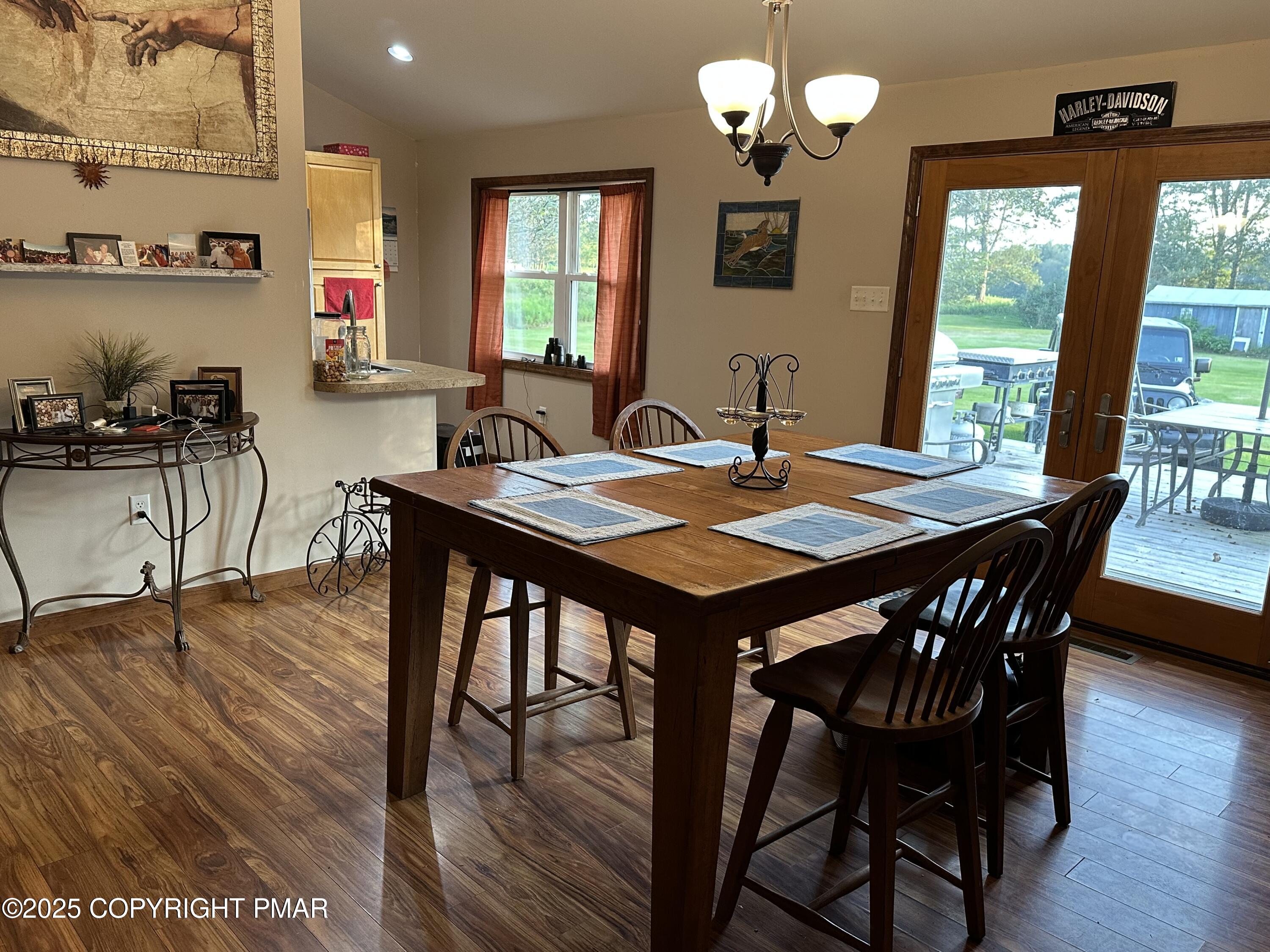 2748 Locust Ridge Road Pocono Lake, PA 18347 - Photo 3 of 17 Open plan dining into kitchen