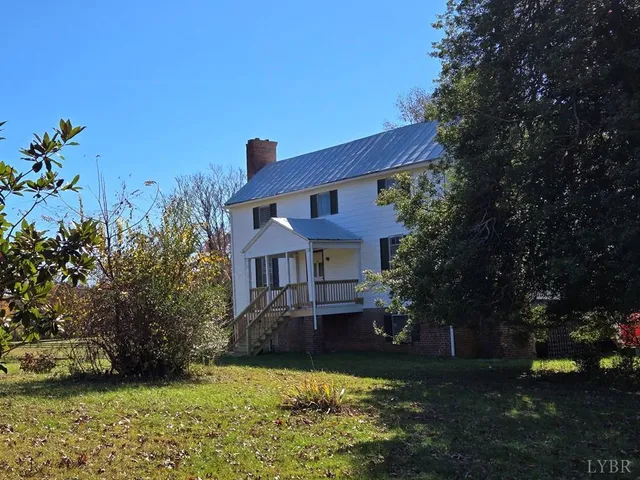 a backyard of a house with lots of green space