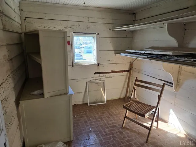 a utility room with cabinets dryer and washer