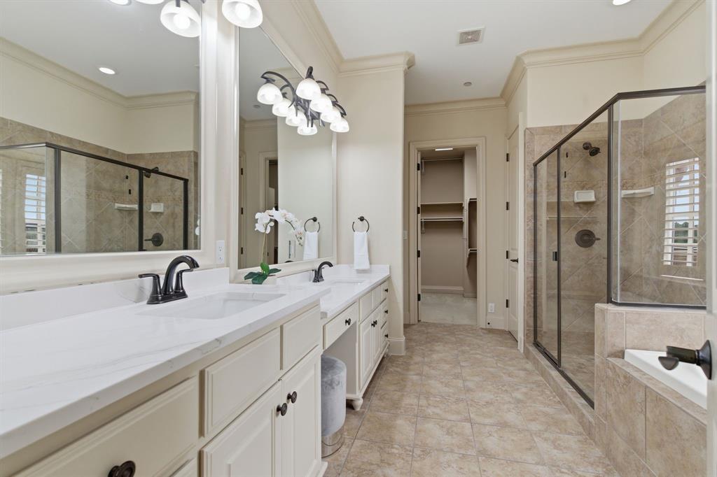 30 Piazza Lane Colleyville, TX 76034 - Photo 19 of 39 Primary with makeup area, deep soaker tub and fireplace