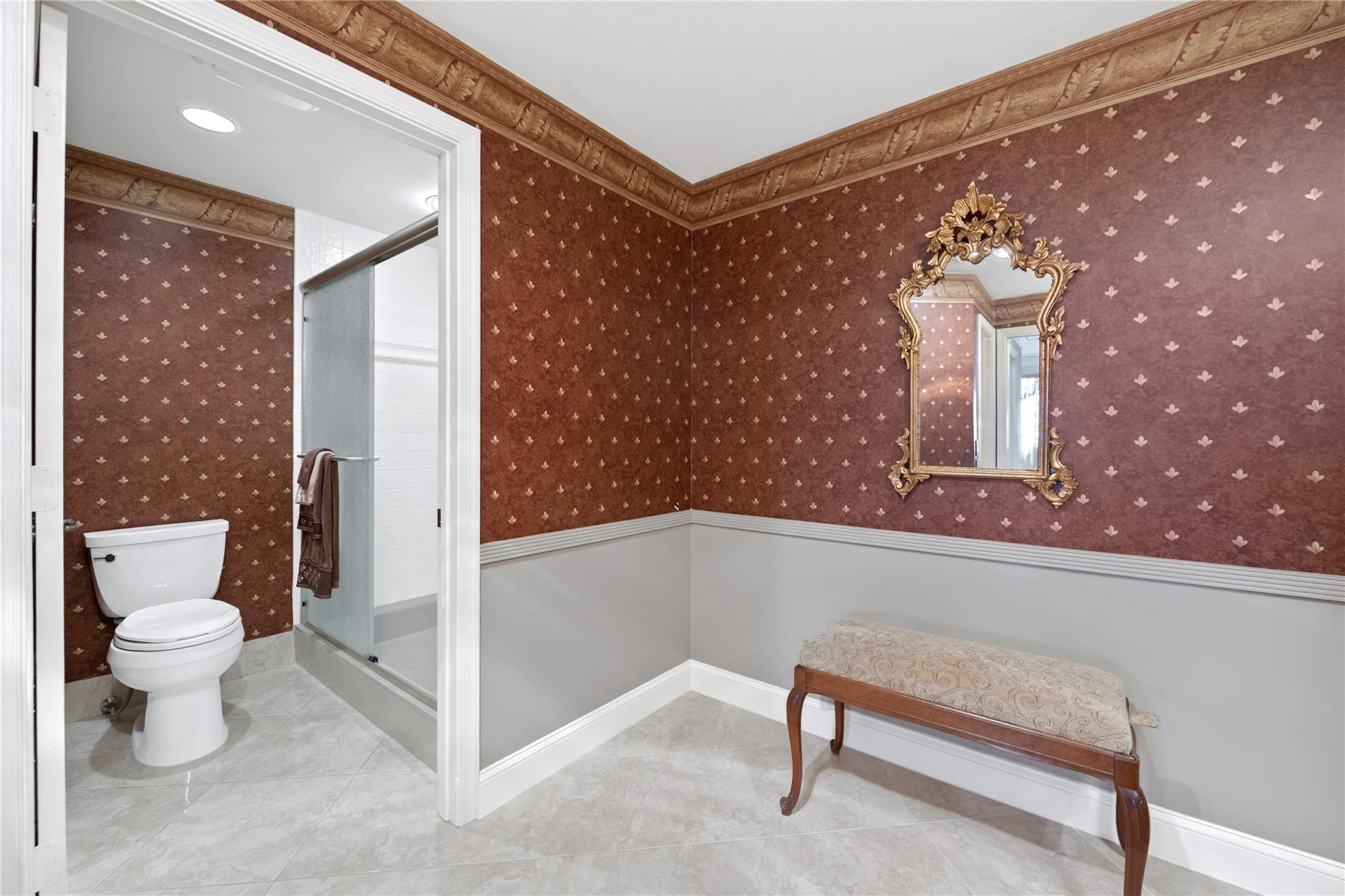 17031 Boca Club Boulevard, Unit 85A Boca Raton, FL 33487 - Photo 17 of 49 a bathroom with a toilet sink and shower