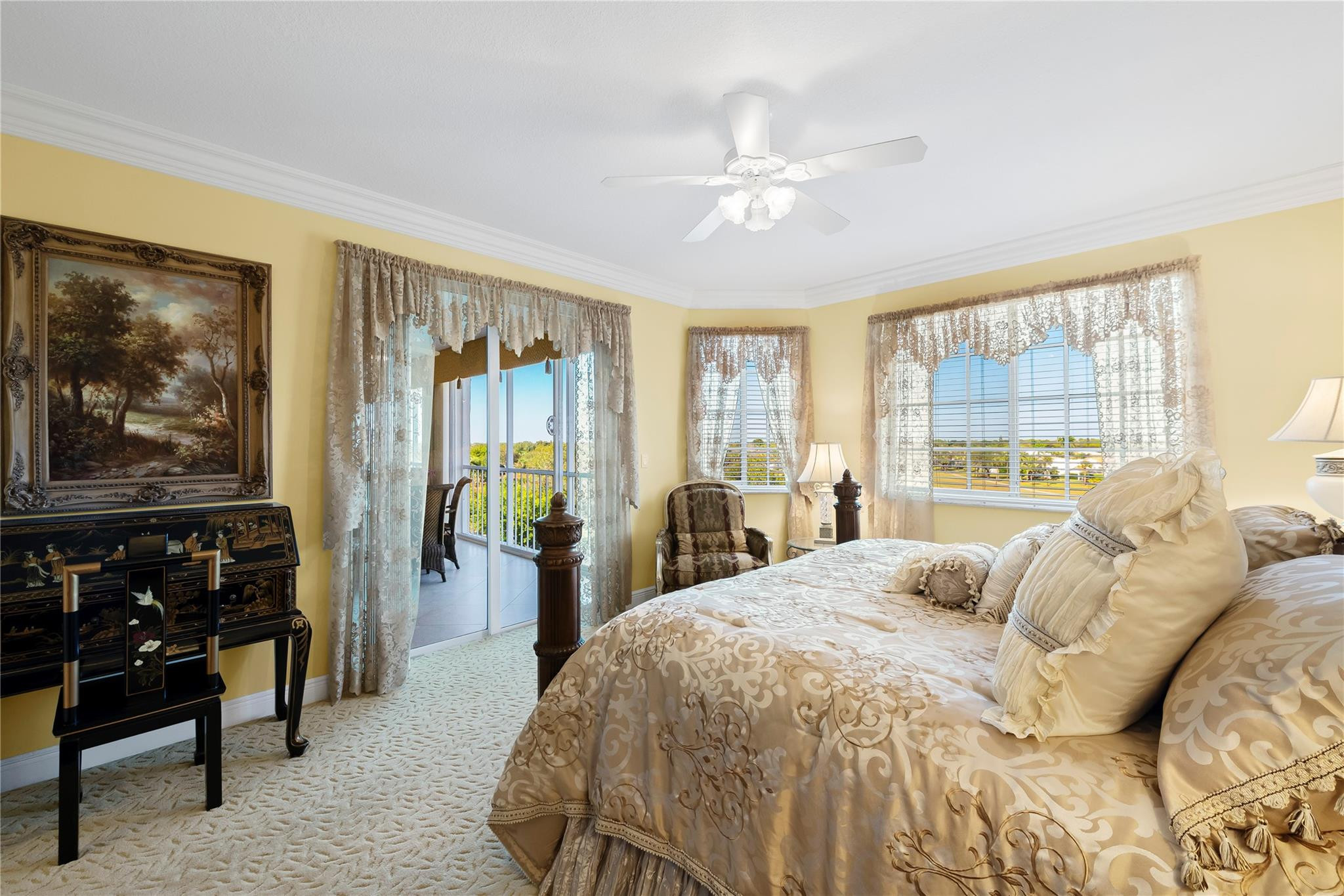 17031 Boca Club Boulevard, Unit 85A Boca Raton, FL 33487 - Photo 19 of 49 a bedroom with a bed and a chandelier