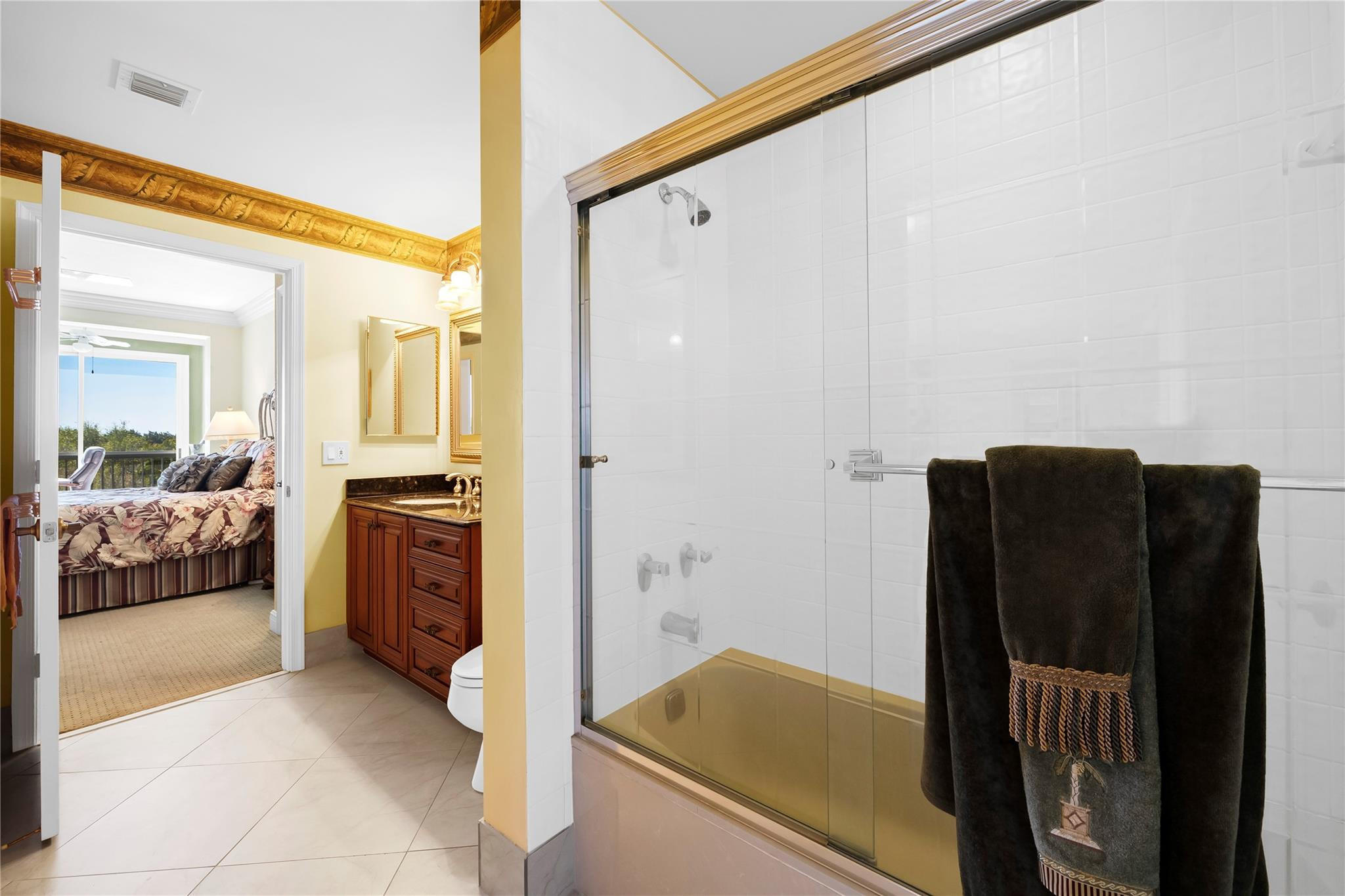 17031 Boca Club Boulevard, Unit 85A Boca Raton, FL 33487 - Photo 21 of 49 a bathroom with a tub and shower